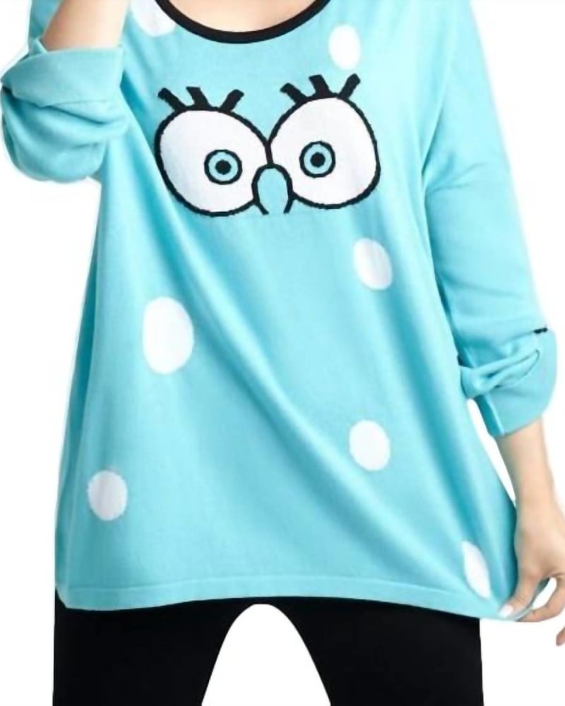Front of a model wearing a size LG Cartoon Graphic Sweater in Turquoise/White in Turquoise/White by ANGEL. | dia_product_style_image_id:325809